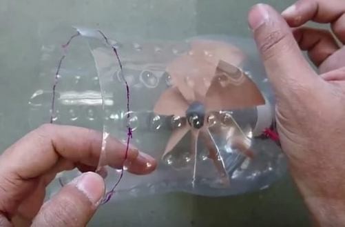 Mount the motor to the bottom of the bottle